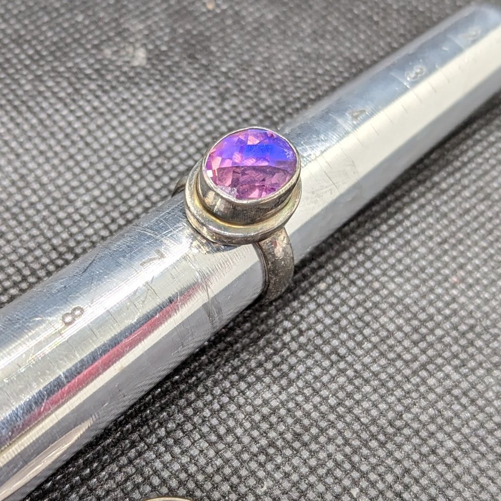 Sterling silver ring with large faceted color shifting topaz